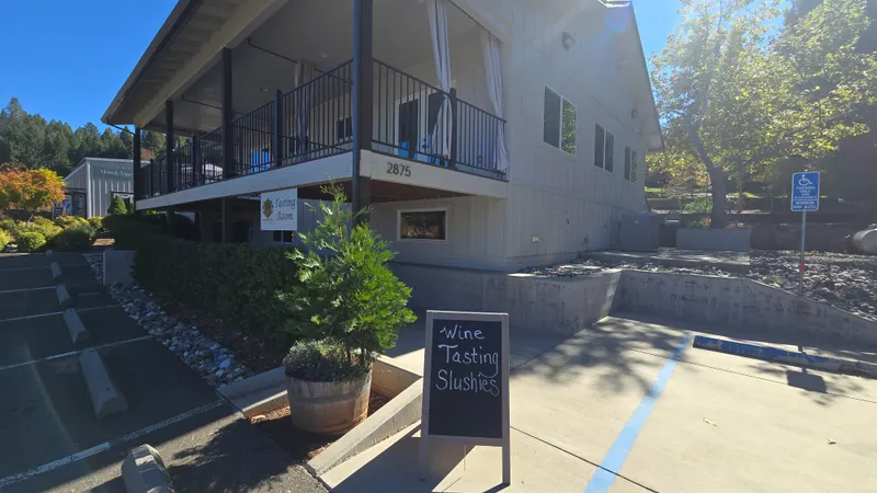 Tasting room entrance with wine tasting and slushies chalkboard sign at Morton Family Cellars